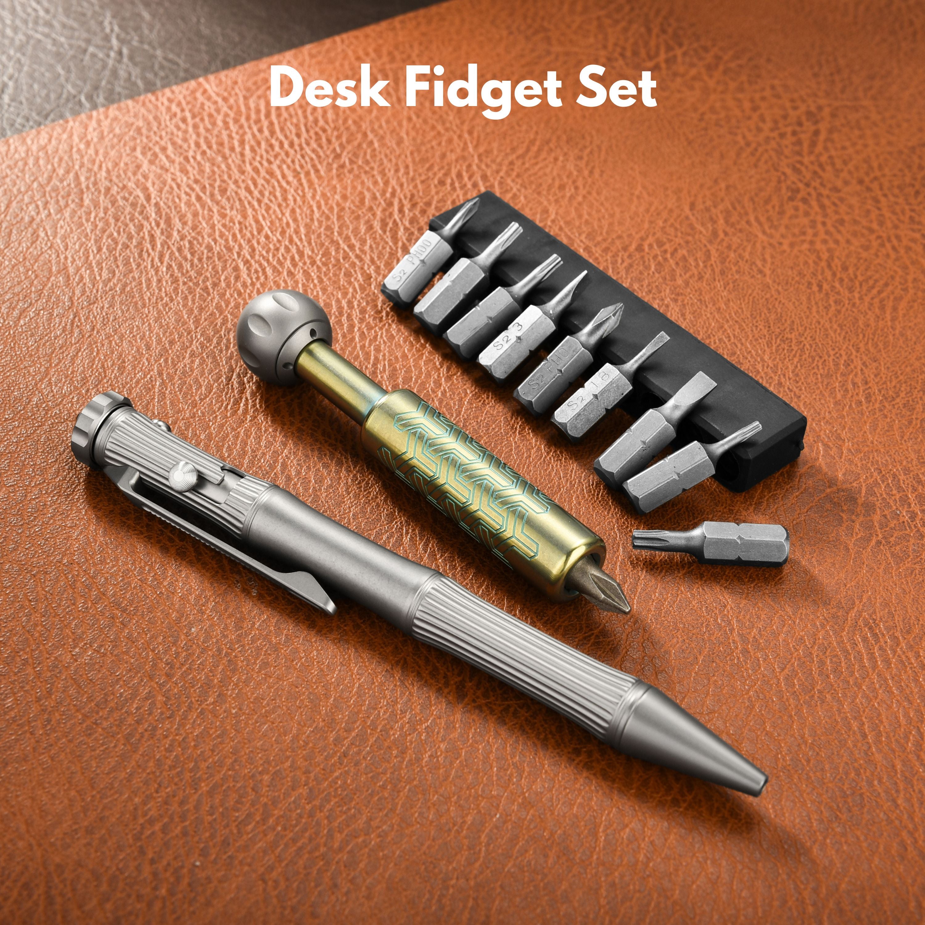 Tacray Desk fidget set with pen and screwdriver bits on a brown surface